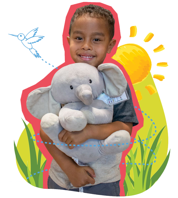 boy holding a stuffed elephant