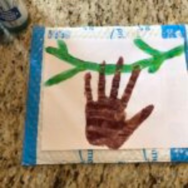 sloth4 Brown handprint on piece of paper.