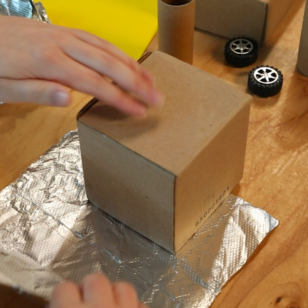 Wrapping cardboard boxes in aluminum foil
