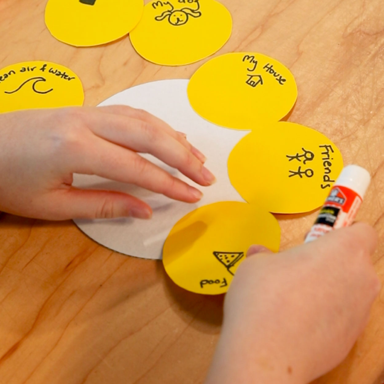 Yellow circles glued to a paper plate