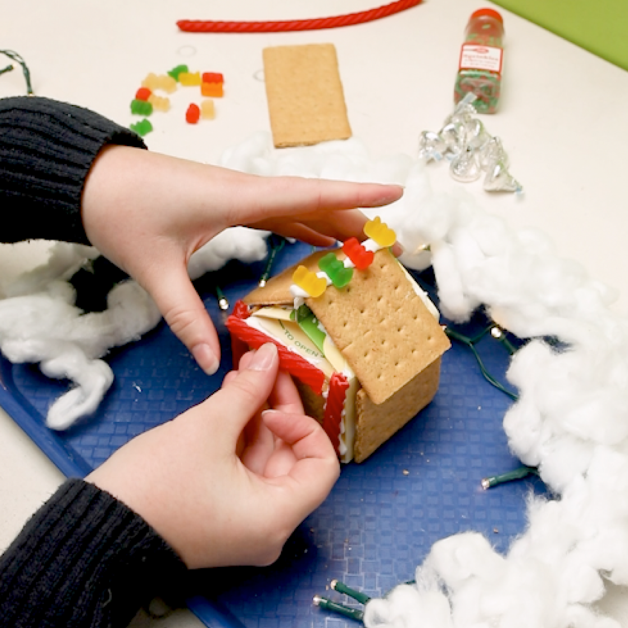Decorating a gingerbread house