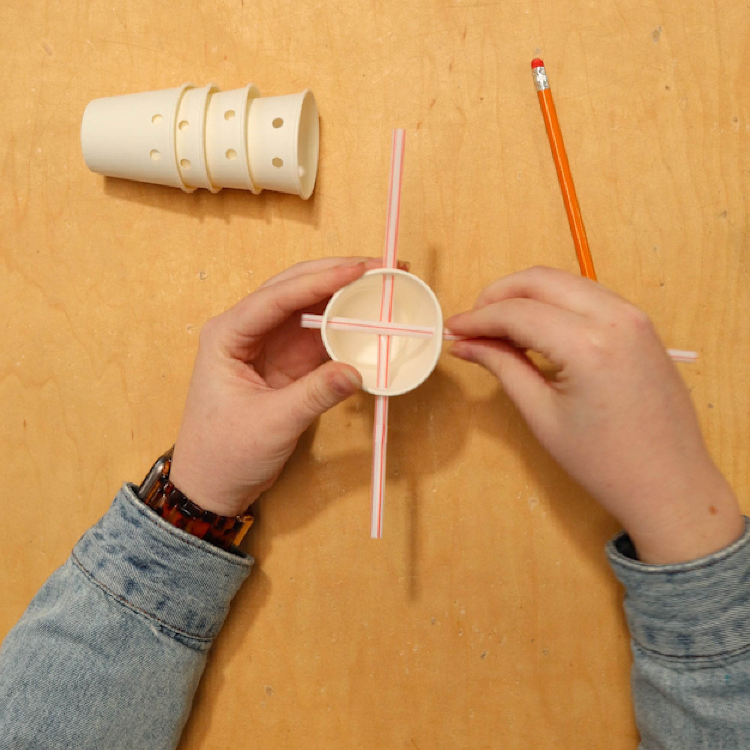 Push straw though the cups