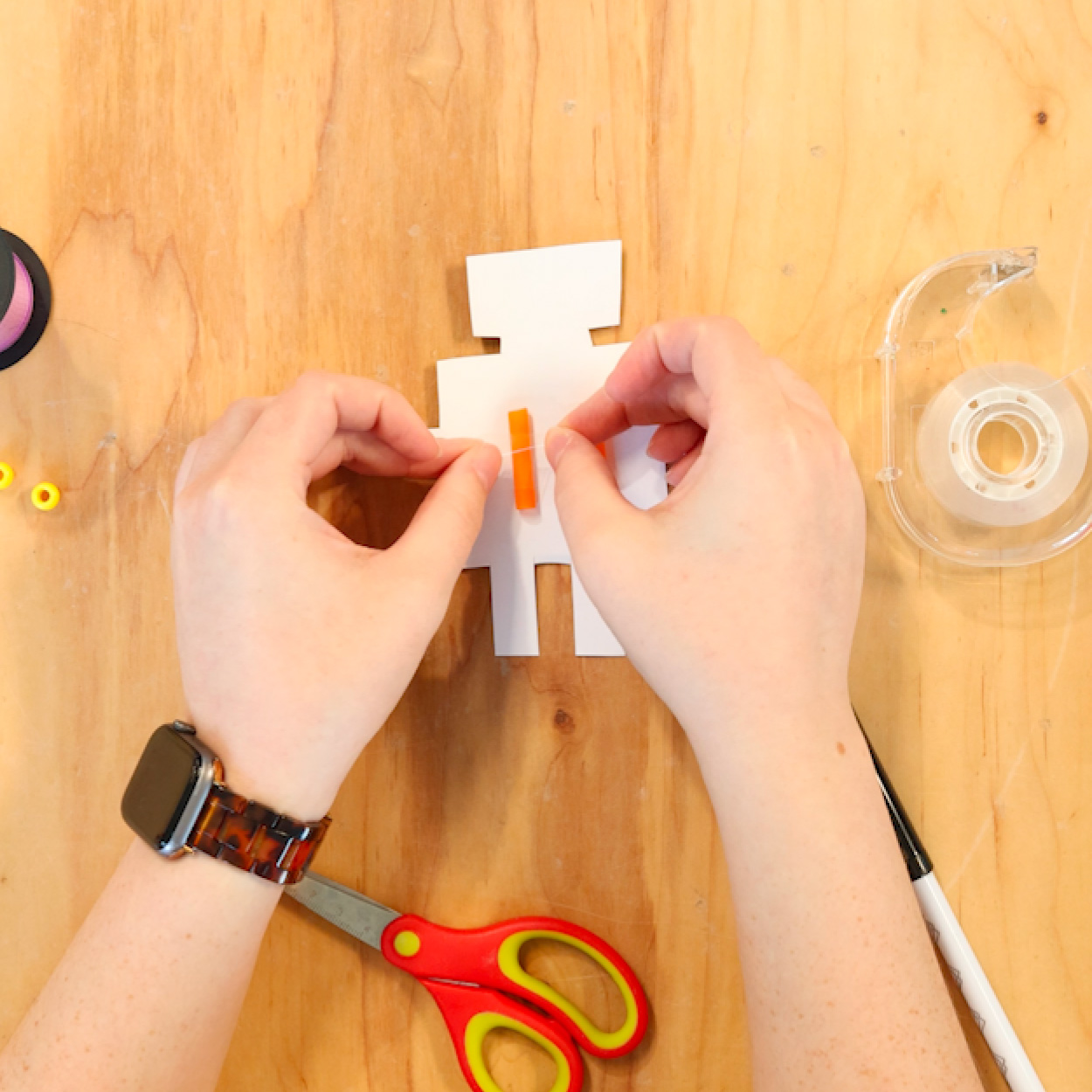 Cut straw and tape to back